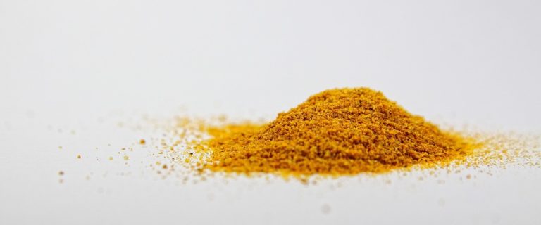turmeric powder on white surface